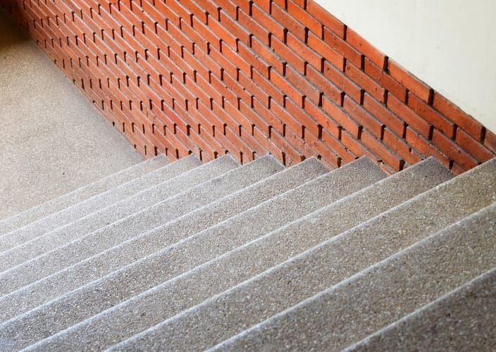 Concrete stairs by Gladstone Concreters and a brick wall